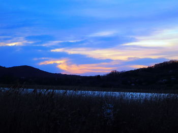 Scenic view of landscape at sunset