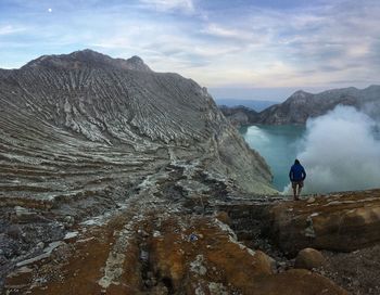 Scenic view of rocks in mountains against sky