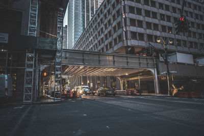 Illuminated city street at night