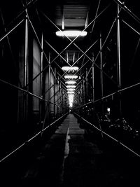 Empty road leading towards building