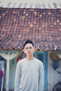 Portrait of young man standing outdoors