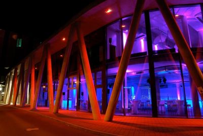 Illuminated buildings in city at night