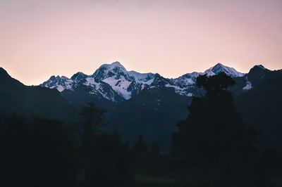 Scenic view of mountains against sky at sunset