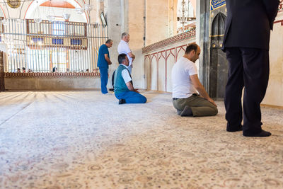 Rear view of people sitting outdoors