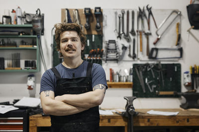 Blacksmith posing in his workshop