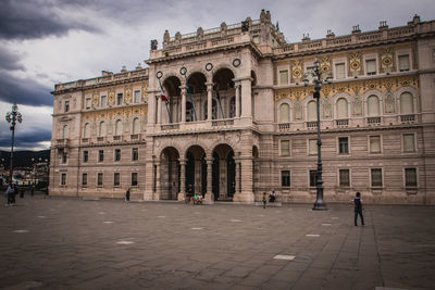 Group of people in front of historical building