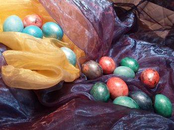 Close-up of easter eggs on colorful fabrics