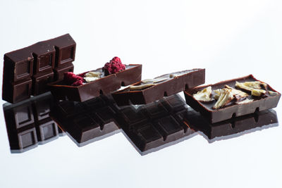 High angle view of chocolate cake against white background