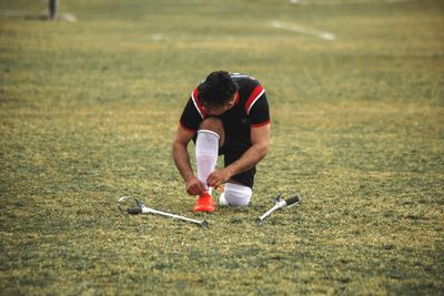 Man playing with ball on grass