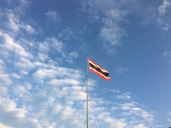 Low angle view of thai nation flag sign against sky