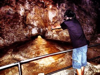 Woman standing on rock