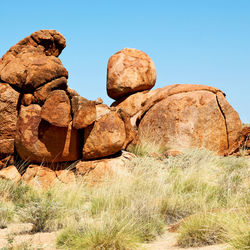 Rock formations on landscape against clear sky