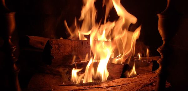 Close-up of fire burning at night