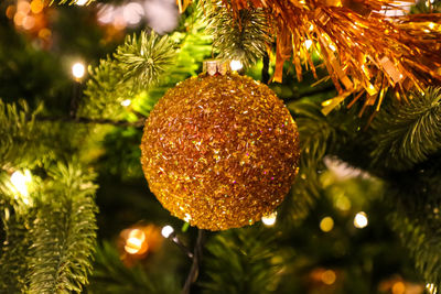 Close-up of christmas decoration hanging on tree