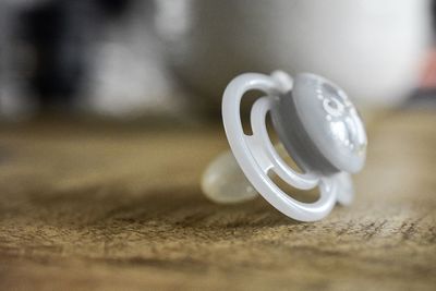 Close-up of wedding rings on table