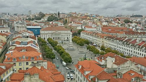 Cityscape against cloudy sky