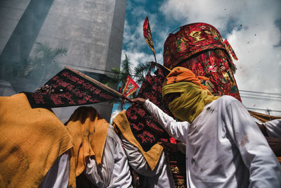 Low angle view of man wearing traditional clothing during celebration