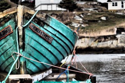 Close-up of fishing boat moored in river