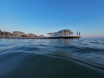 Scenic view of sea against clear blue sky