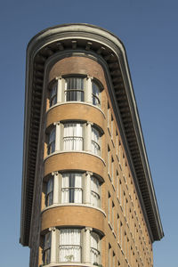 Low angle view of building against clear blue sky