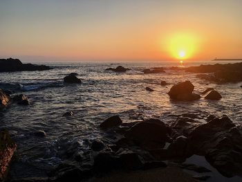 Scenic view of sea against sky during sunset