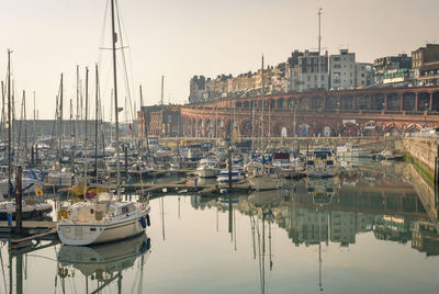 Boats moored at harbor