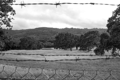 Scenic view of mountains against cloudy sky