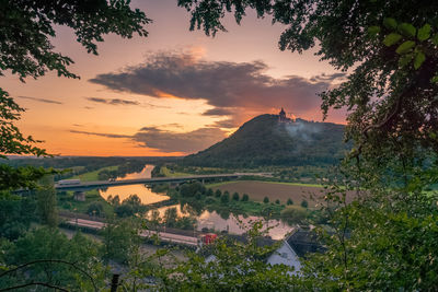 View mountain and river during sunset