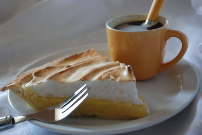 Close-up of cake and coffee on table