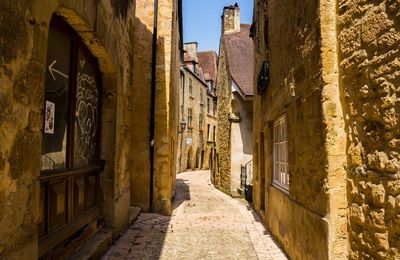 Alley amidst houses in old town