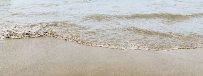 High angle view of surf on beach