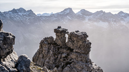 Scenic view of snowcapped mountains against sky