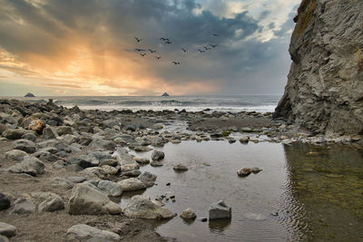 Scenic view of sea against sky during sunset