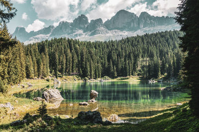 Scenic view of lake and mountains against sky