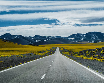 Empty road along landscape
