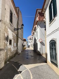 Narrow alley amidst buildings in city
