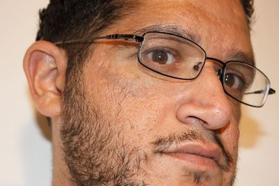 Close-up portrait of man wearing eyeglasses