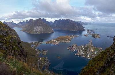 Panoramic view of sea and mountains against sky