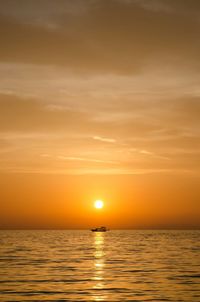 Scenic view of sea at sunset