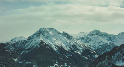 Scenic view of snowcapped mountains against sky