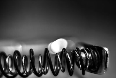 Close-up of spiral wire on table