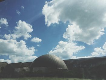 Building against cloudy sky