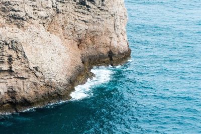 Close-up of rock formation in sea