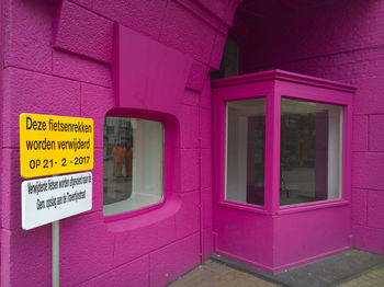 Text on pink window