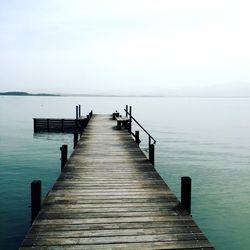 Jetty leading to calm sea