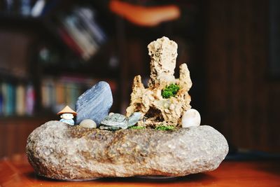 Figurines with stone decor on table