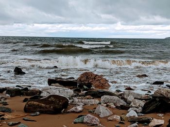 Scenic view of sea shore against sky