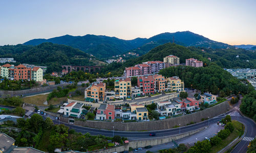 High angle view of buildings in city against clear sky