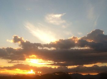 Low angle view of dramatic sky during sunset