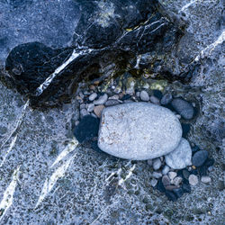 High angle view of stones in water